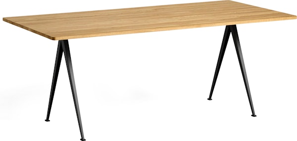 A front angle view of the Pyramid Table with overhang in Oak top and Black frame.